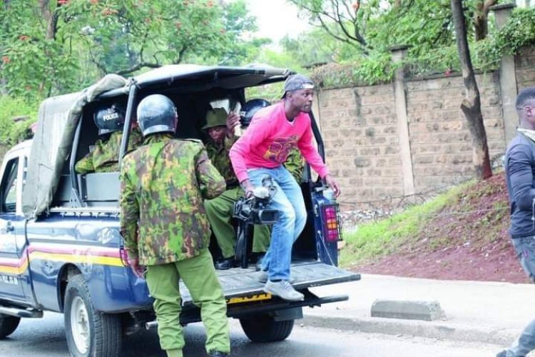 What is the name of the journalist captured in this photo disembarking from a police car and which media house does he work for?